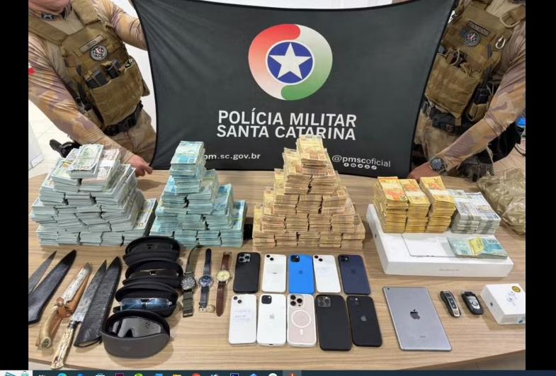 Foragido suspeito de fraude bilionária foi encontrado com mais de R$ 1 milhão em espécie dentro de hotel de SC — Foto: PM/Divulgação